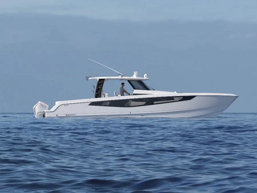 A sleek white boat navigates calm blue waters, with a person steering from the helm under a clear sky.